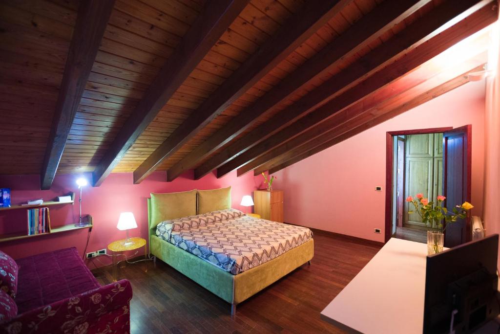 Łóżko lub łóżka w pokoju w obiekcie B&B Villa Nella