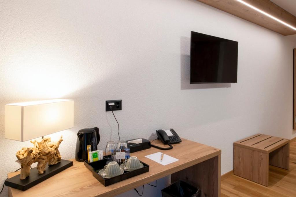 TV a/nebo společenská místnost v ubytování Boutique hôtel Corbetta - SPA 60m2 - La montagne à 5 minutes de l'autoroute A12 aux Paccots sur Montreux - NOUVEAU Loft familial - Profitez du Lac Léman et des montagnes en même temps