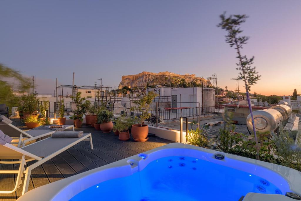 a hot tub on the roof of a building at Your 4 bdrm Dream House Acropolis View & Jacuzzi in Athens