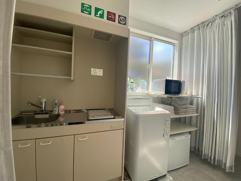 Kuchyň nebo kuchyňský kout v ubytování Guest House DARUMA