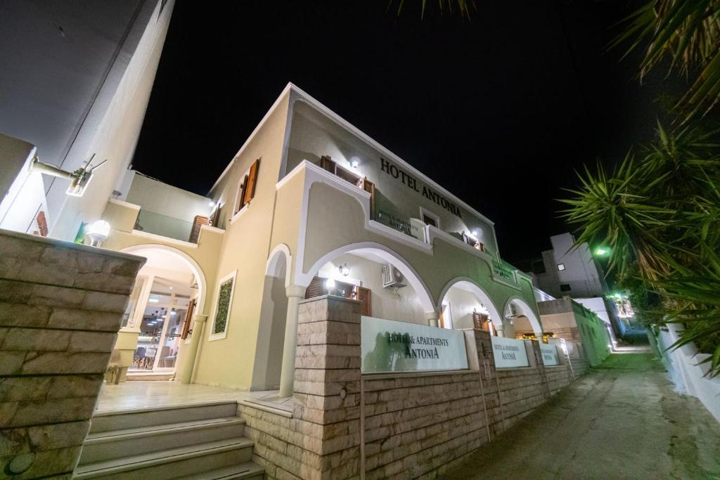 a large building at night with lights on it at Antonia Hotel in Fira