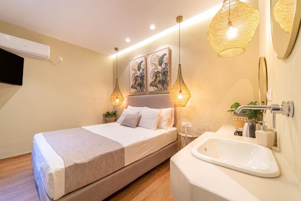 Postel nebo postele na pokoji v ubytování Antonia Hotel