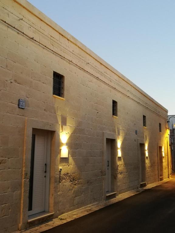 a brick building with lights on the side of it at CH Guest House in Vernole