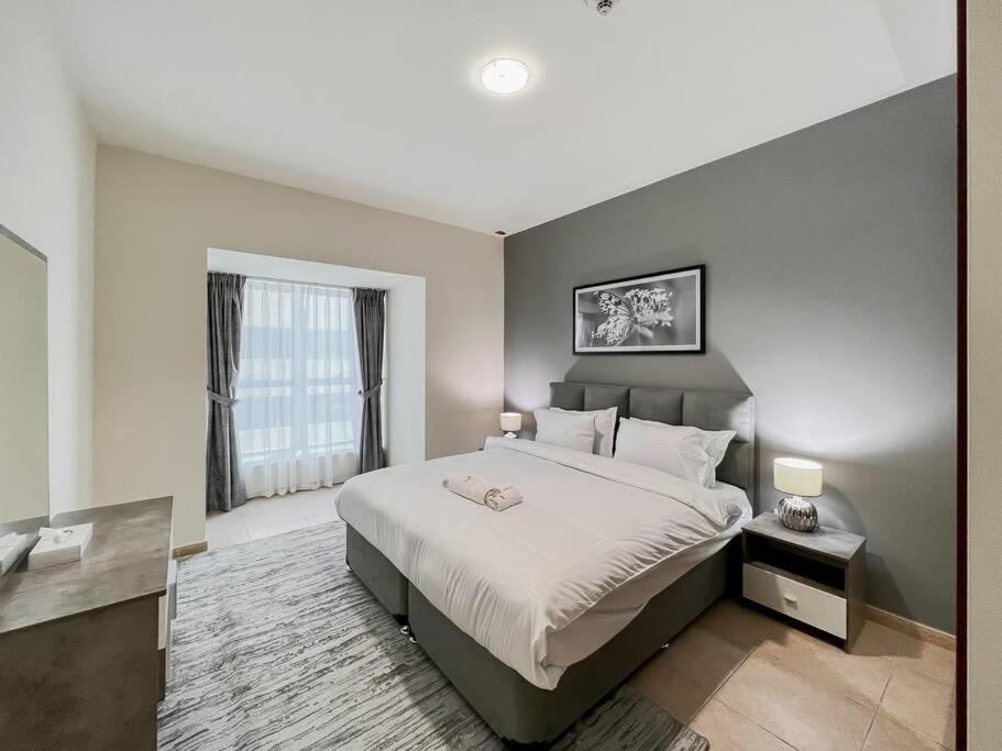 Postel nebo postele na pokoji v ubytování StoneTree - Elite Residence 1 BR - Near Dubai Tram