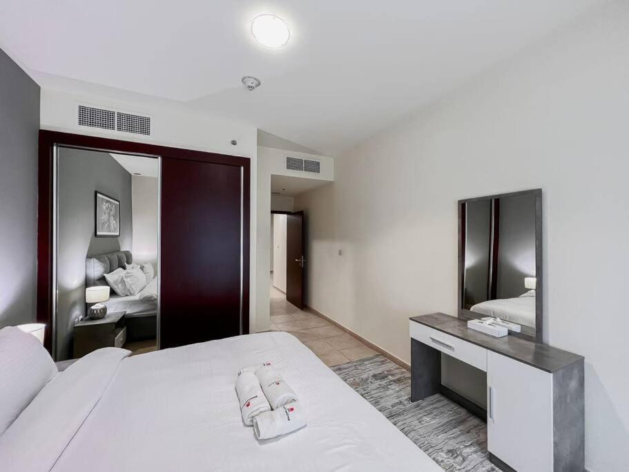 Postel nebo postele na pokoji v ubytování StoneTree - Elite Residence 1 BR - Near Dubai Tram