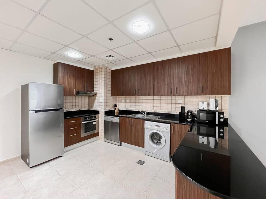 Kuchyň nebo kuchyňský kout v ubytování StoneTree - Elite Residence 1 BR - Near Dubai Tram