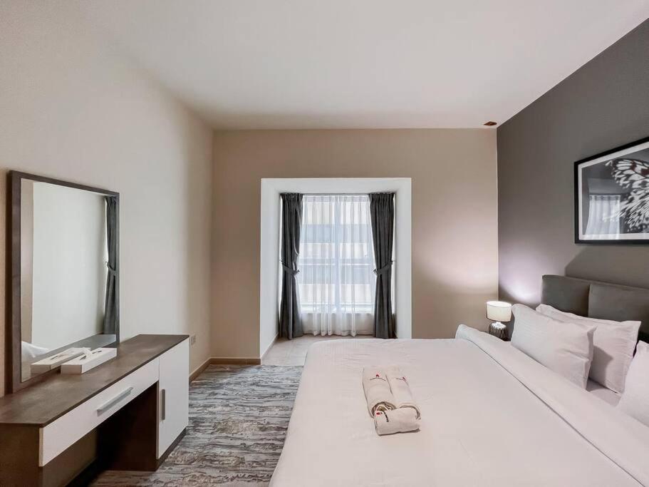 Postel nebo postele na pokoji v ubytování StoneTree - Elite Residence 1 BR - Near Dubai Tram