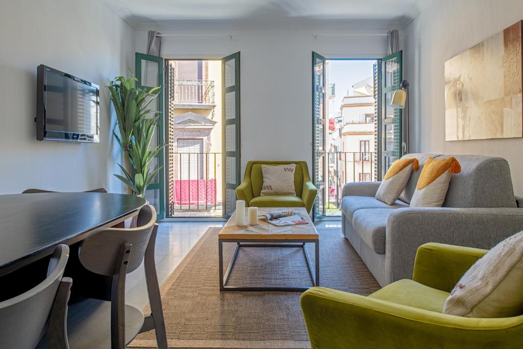 Predel za sedenje v nastanitvi Suites Maestranza - Puerta del Arenal by Magno Apartments