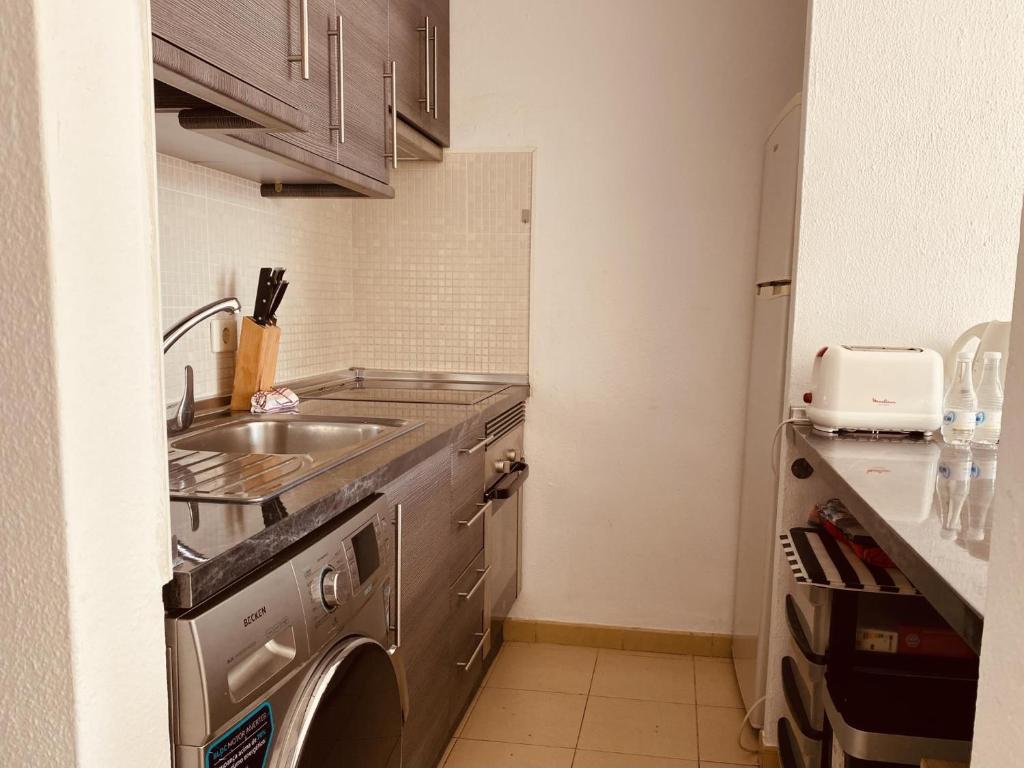 Kuchyň nebo kuchyňský kout v ubytování Sol y Luna Holiday Home