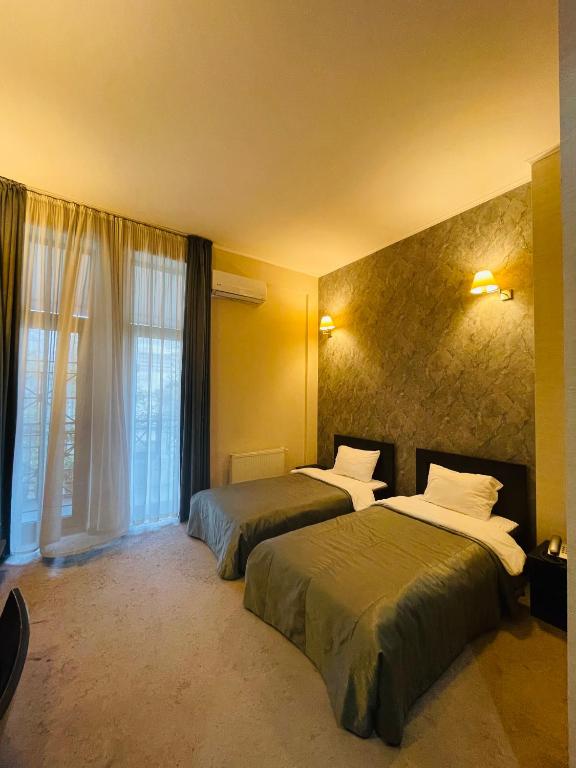 Postel nebo postele na pokoji v ubytování Monte Carlo