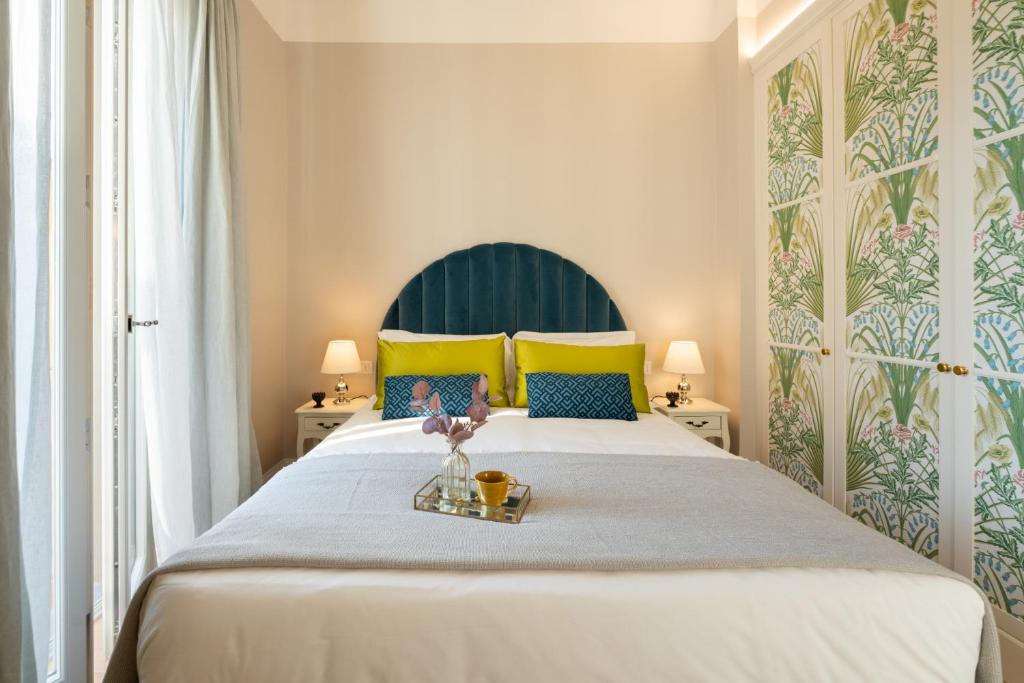 A bed or beds in a room at Apartments Florence- Granduca Penthouse