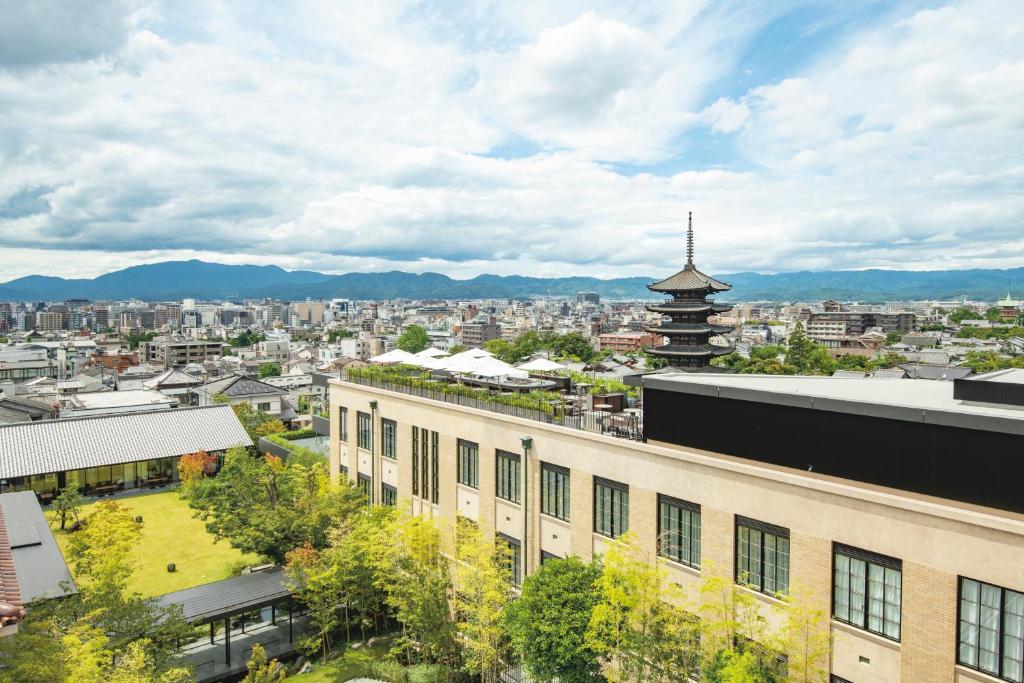 a view of a city with a building and a pagoda at The Hotel Seiryu Kyoto Kiyomizu in Kyoto