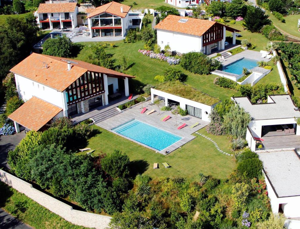 an aerial view of a house with a swimming pool at Lafitenia Resort in Saint-Jean-de-Luz