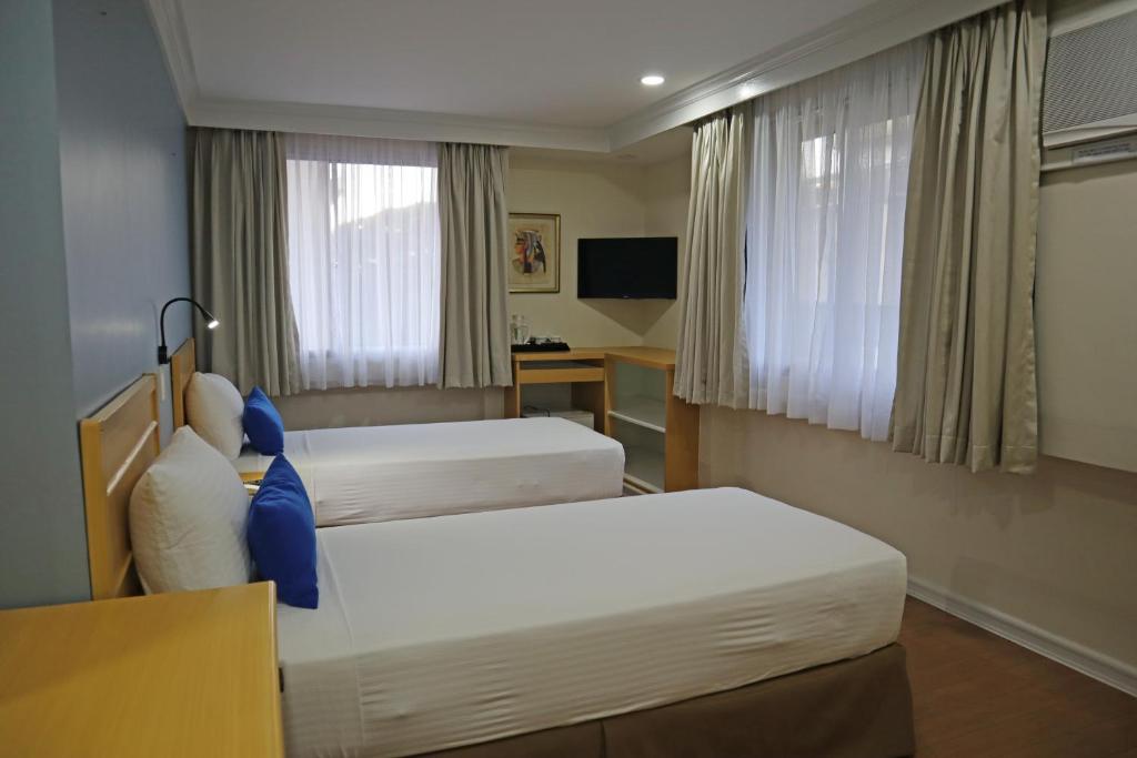 Postel nebo postele na pokoji v ubytování Fersal Hotel Malakas, Quezon City