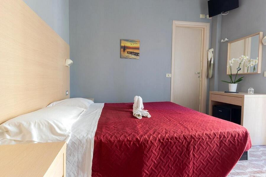 Postel nebo postele na pokoji v ubytování Hotel Kennedy