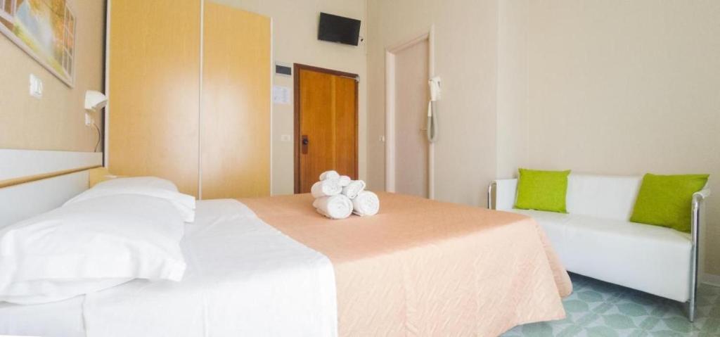 Postel nebo postele na pokoji v ubytování Hotel Kennedy