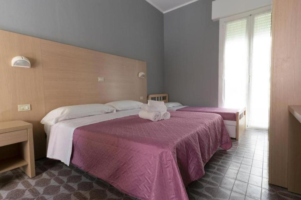 Postel nebo postele na pokoji v ubytování Hotel Kennedy