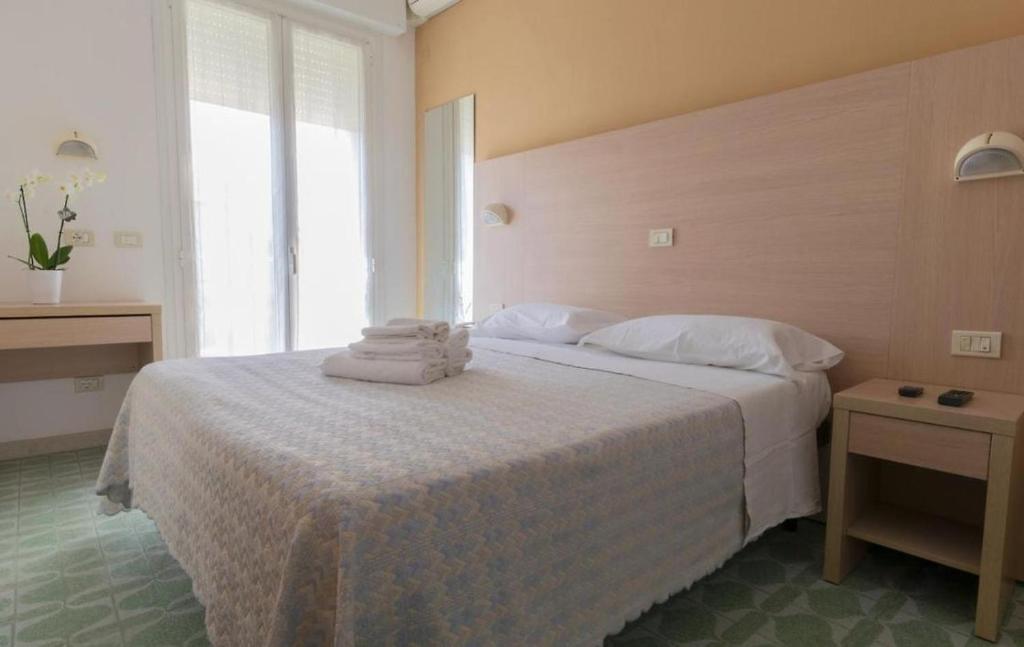 Postel nebo postele na pokoji v ubytování Hotel Kennedy