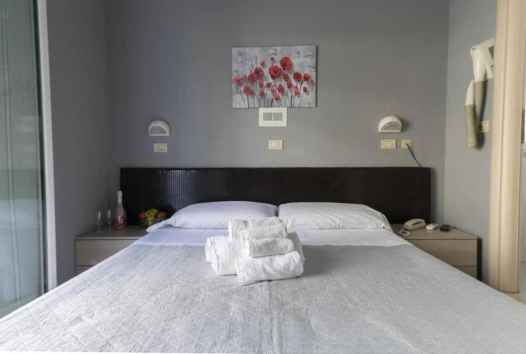 Postel nebo postele na pokoji v ubytování Hotel Kennedy