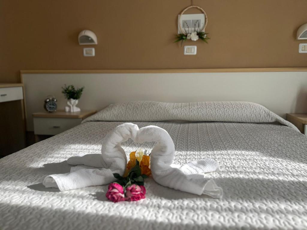 Postel nebo postele na pokoji v ubytování Hotel Kennedy