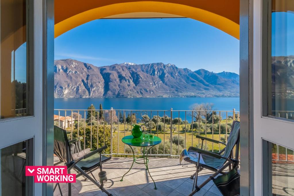 a balcony with a view of a lake and mountains at Ca' Maria Lavanda by Wonderful Italy in Bellagio