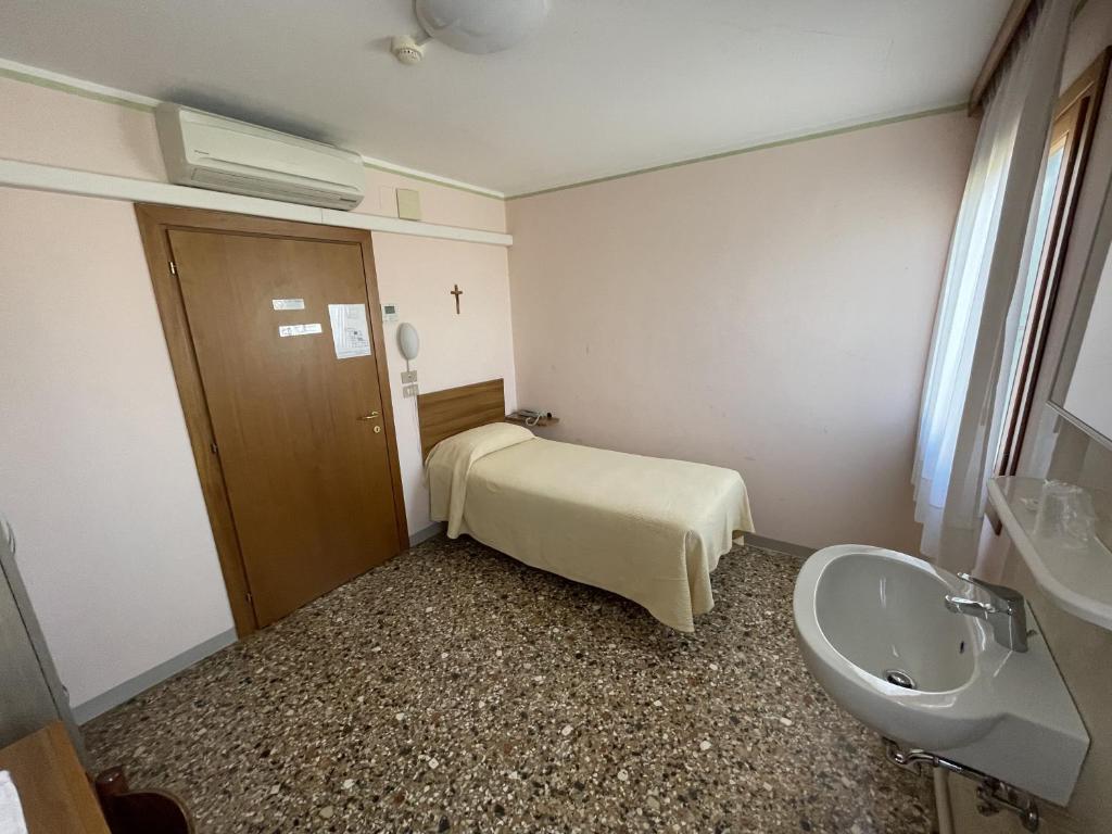 Postel nebo postele na pokoji v ubytování Casa Caburlotto