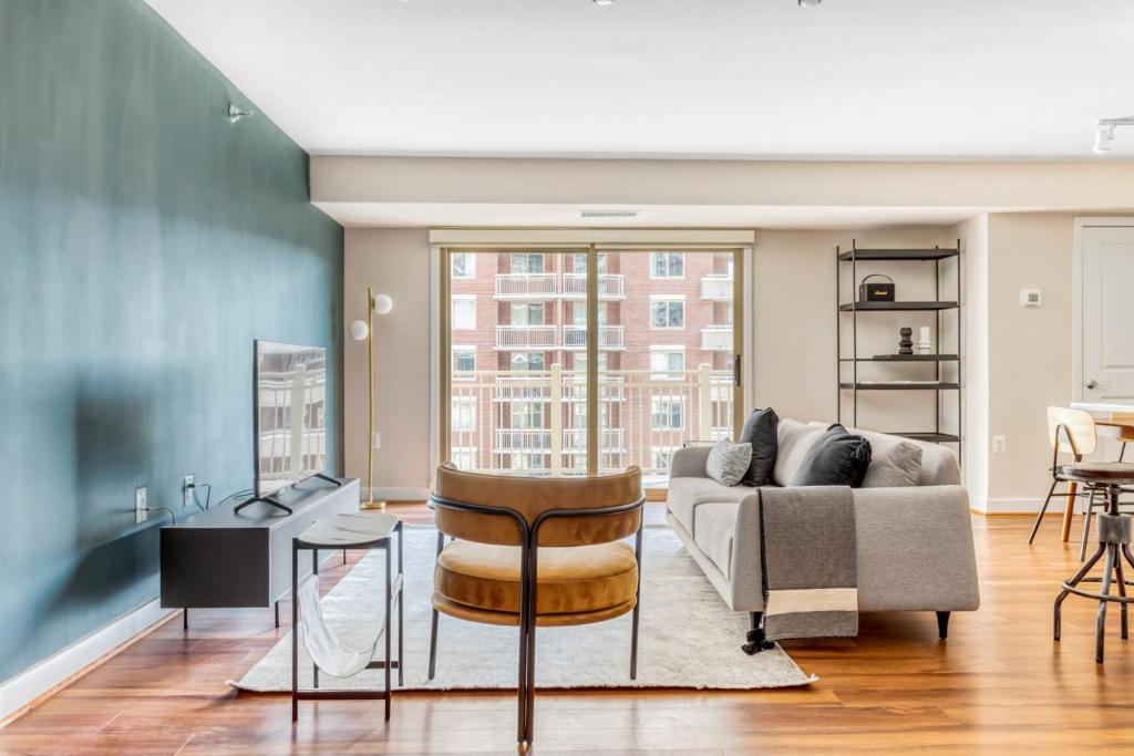a living room with a couch and a table at Ballston 2BR w Concierge WD Pool nr Metro WDC-504 in Arlington