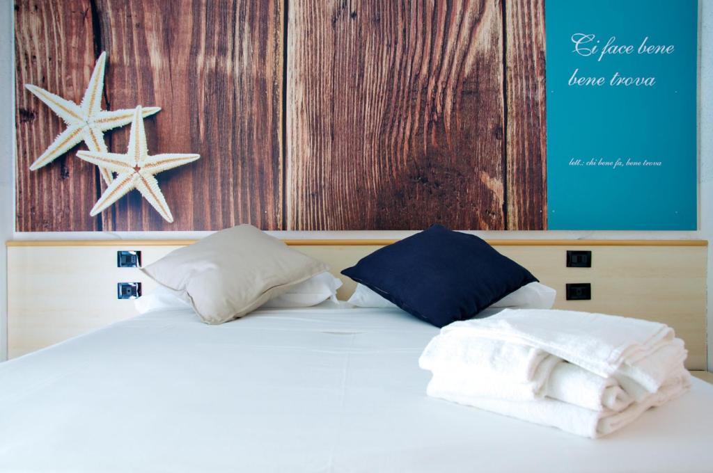 Postel nebo postele na pokoji v ubytování Apulia Hotel Ugento Cala Blu