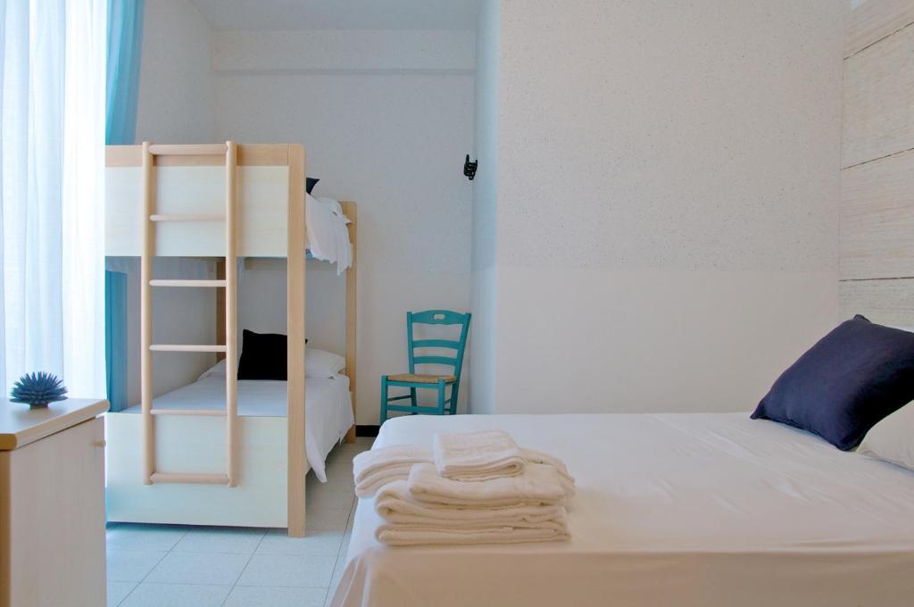 Postel nebo postele na pokoji v ubytování Apulia Hotel Ugento Cala Blu