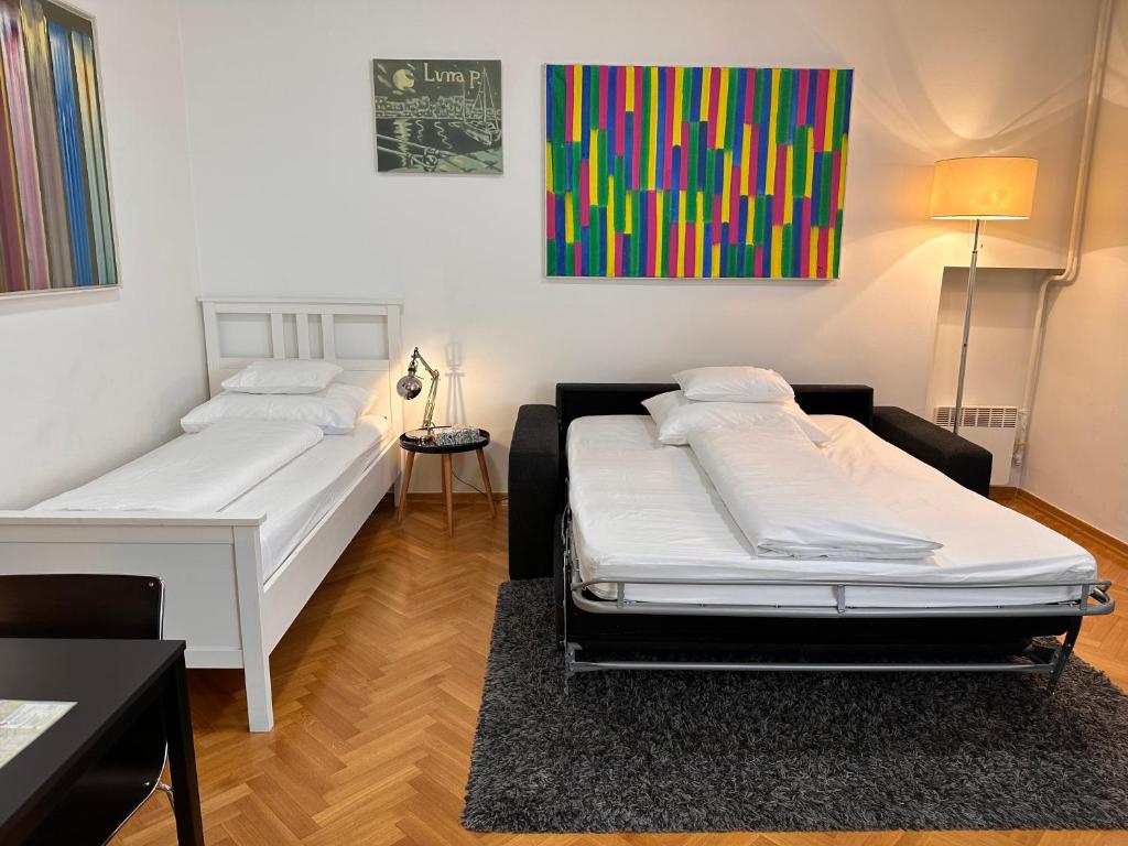 Postel nebo postele na pokoji v ubytování Apartments Mango Downtown