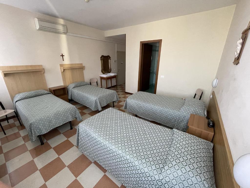 Postel nebo postele na pokoji v ubytování Casa Caburlotto