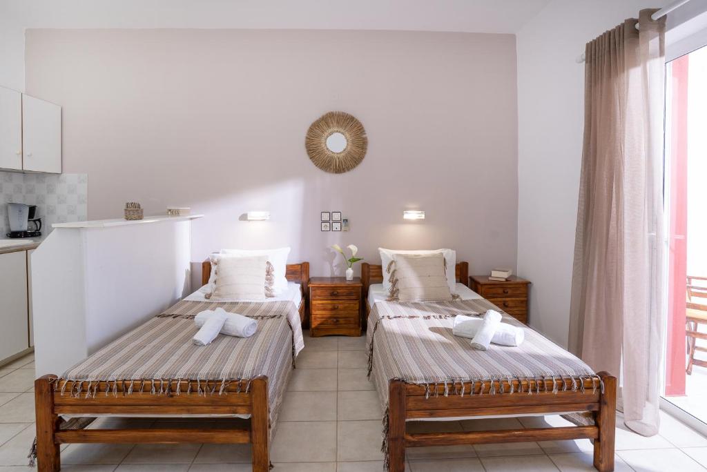 Postel nebo postele na pokoji v ubytování Emerald Hotel Leros