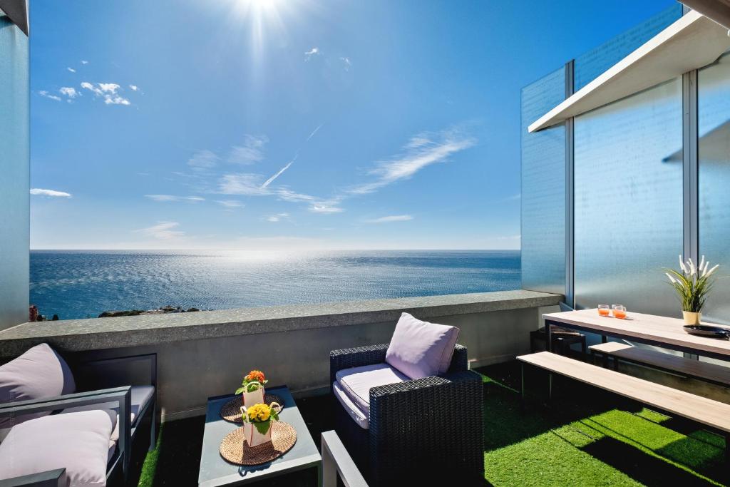 a balcony with a view of the ocean at Sea view - 5min Monaco - Swimming pool in Cap d'Ail