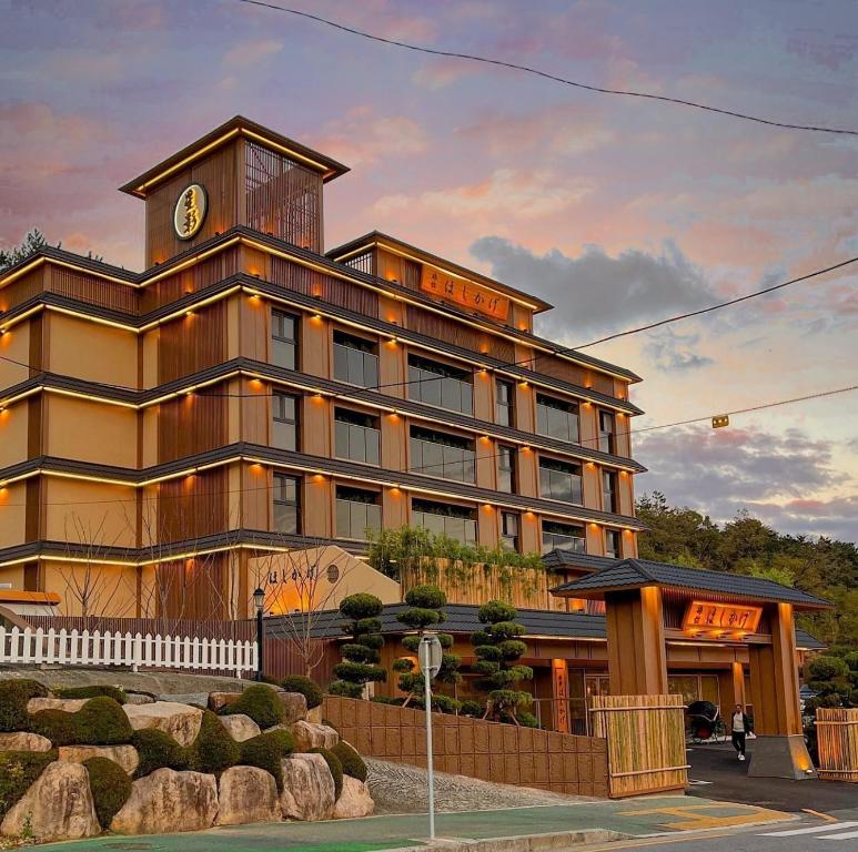 a building with a clock tower on top of it at Hoshikage Ryokan Hotel in Busan