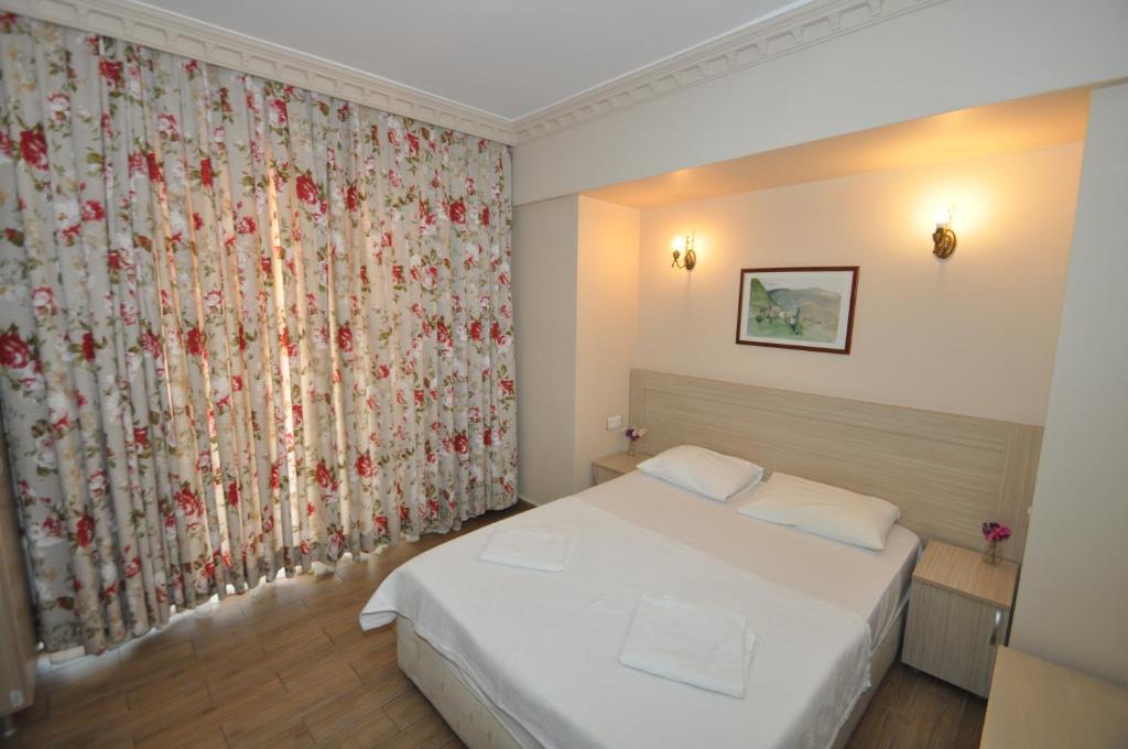 Postel nebo postele na pokoji v ubytování Sun Blue Apart Hotel