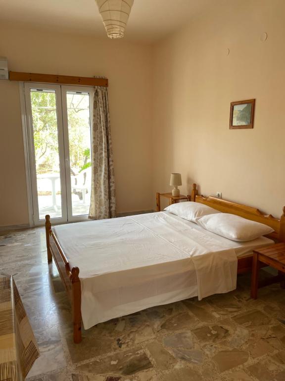 Postel nebo postele na pokoji v ubytování Andreas Studios