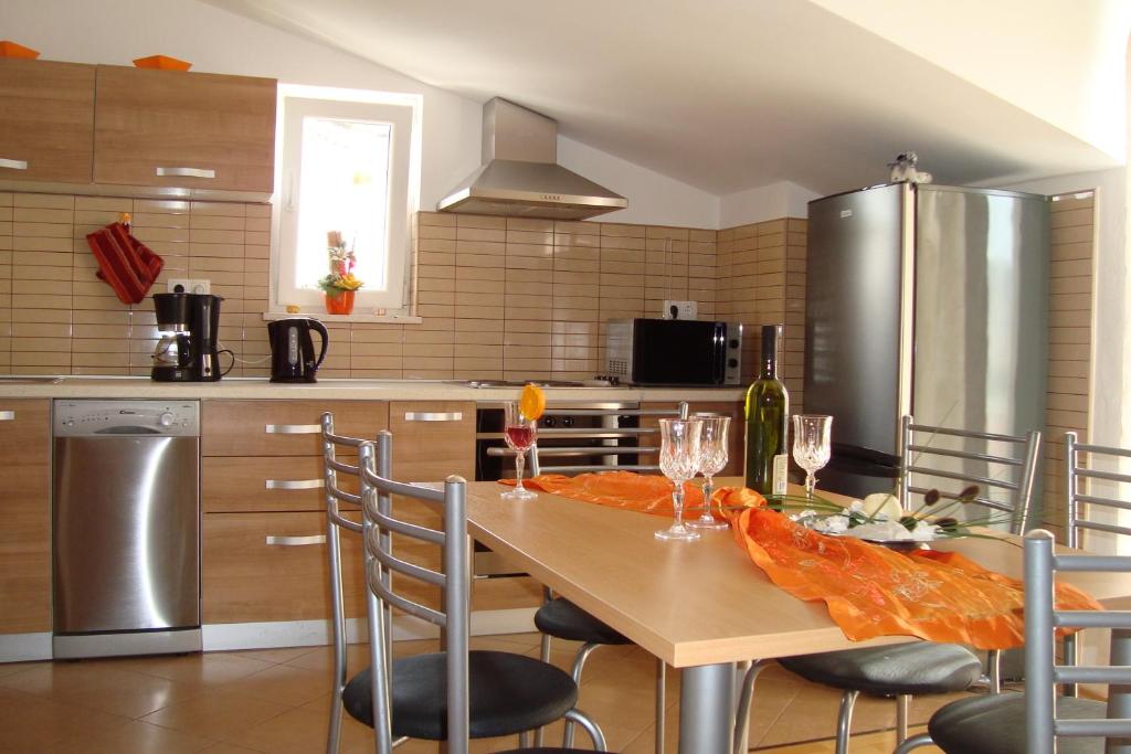 Kuchyň nebo kuchyňský kout v ubytování Apartments Bulicic