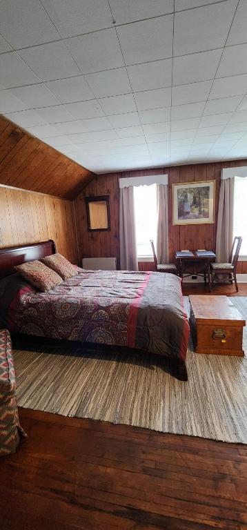 a bedroom with a large bed in a room at Super Spacious 1 bedroom w/n walking dist' to town in Manistee