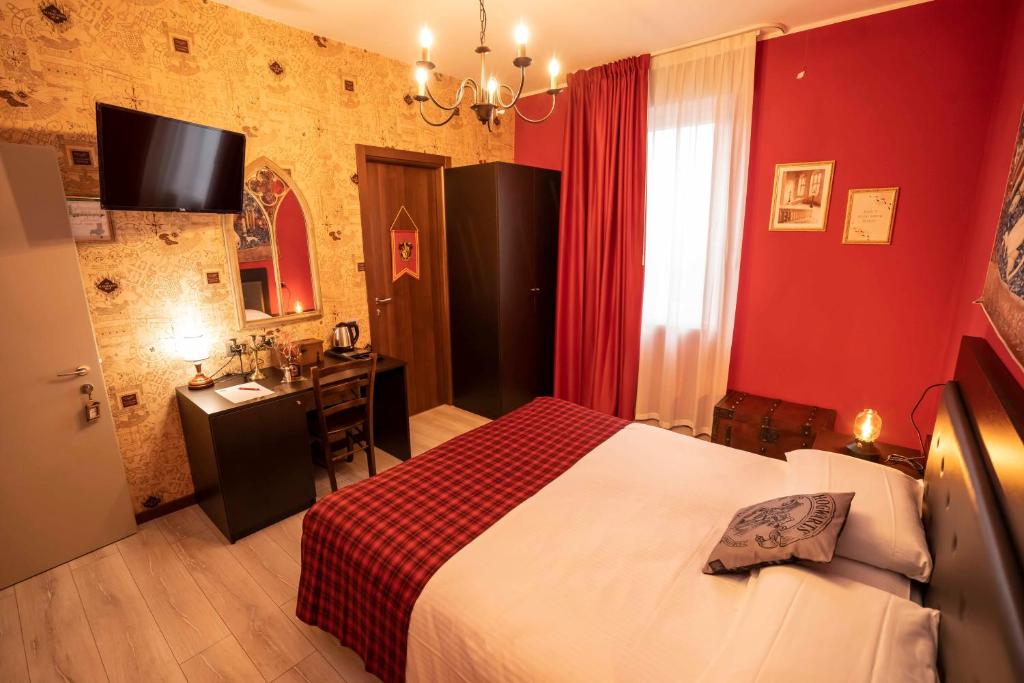 Postel nebo postele na pokoji v ubytování Binario Magic RistoHotel