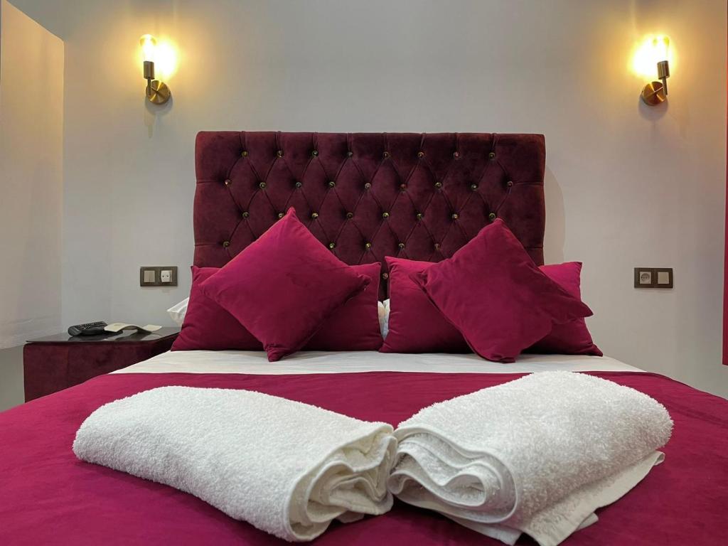 Ένα ή περισσότερα κρεβάτια σε δωμάτιο στο Hotel Palace tanger