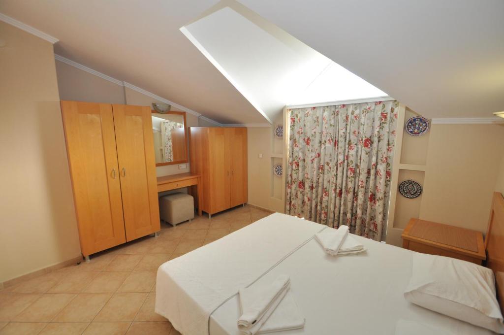 Postel nebo postele na pokoji v ubytování Sun Blue Apart Hotel