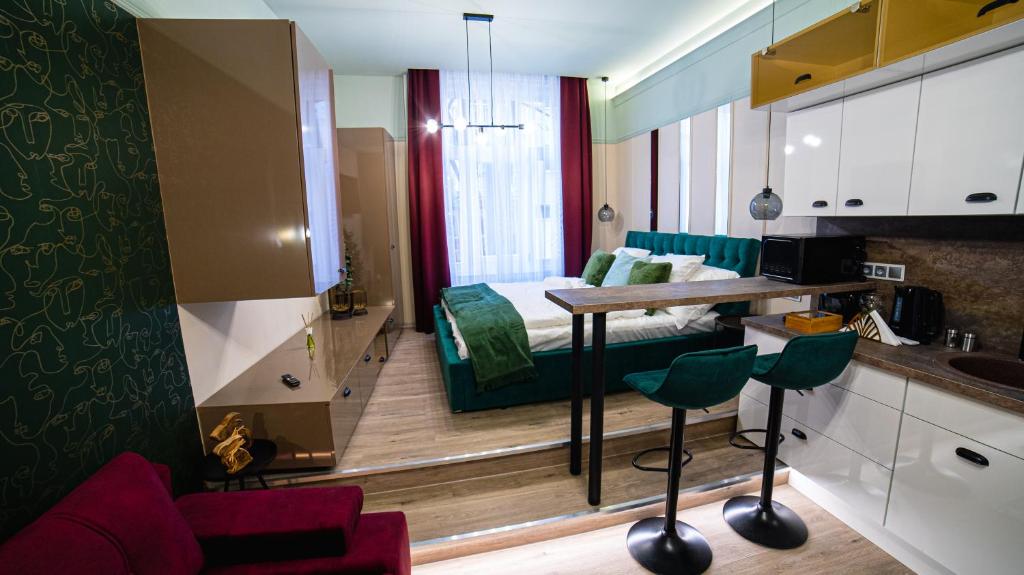 a room with a kitchen and a living room at Dream Apartments in Szeged