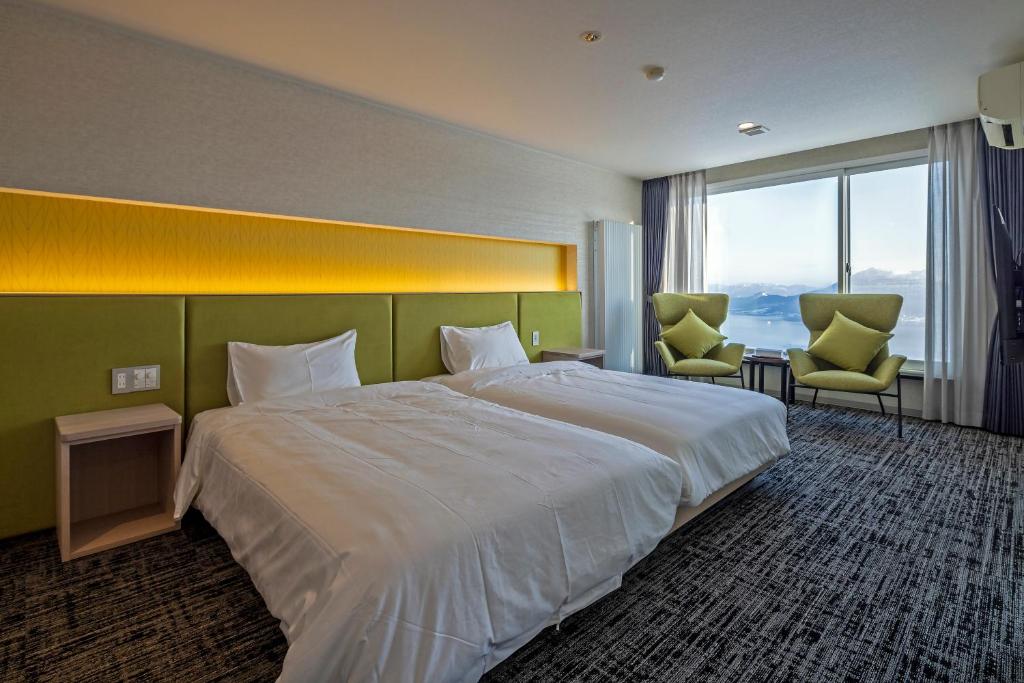 Postel nebo postele na pokoji v ubytování HOTEL COCOA RESORT
