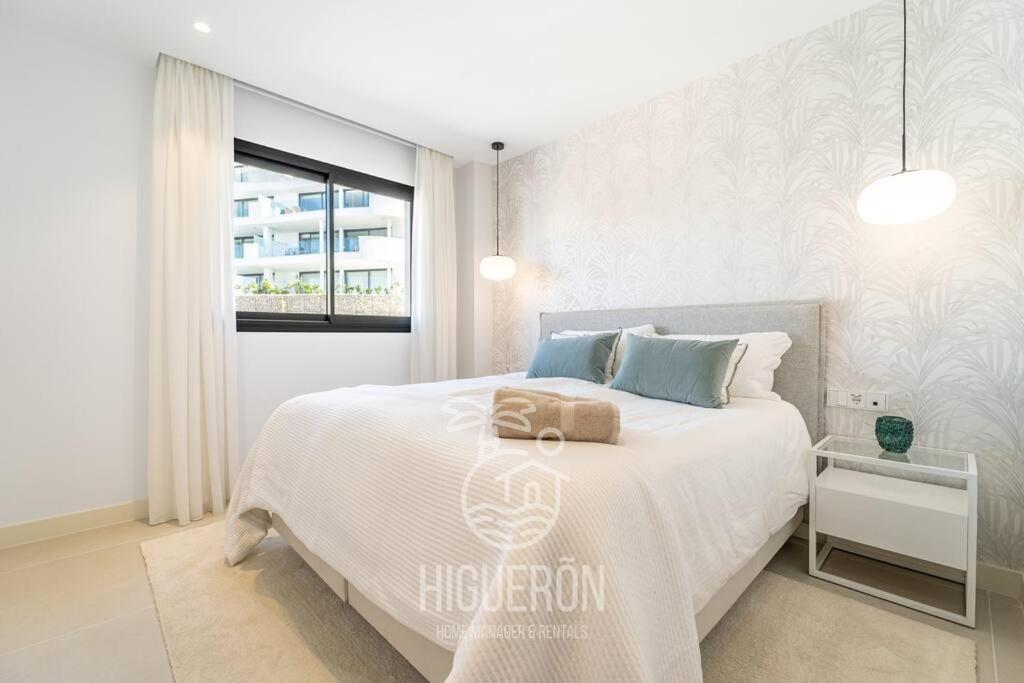 Posteľ alebo postele v izbe v ubytovaní HigueronRentals Casa Flora