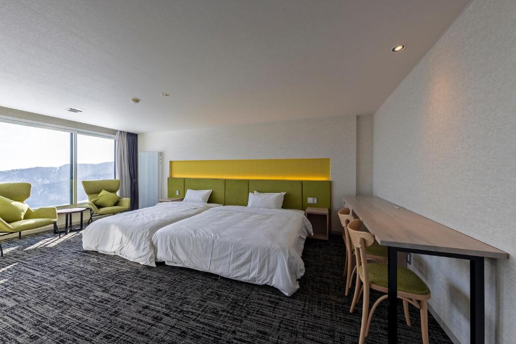 Postel nebo postele na pokoji v ubytování HOTEL COCOA RESORT