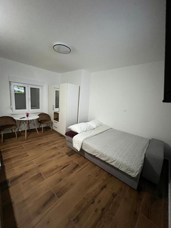 מיטה או מיטות בחדר ב-Guest House Ivan