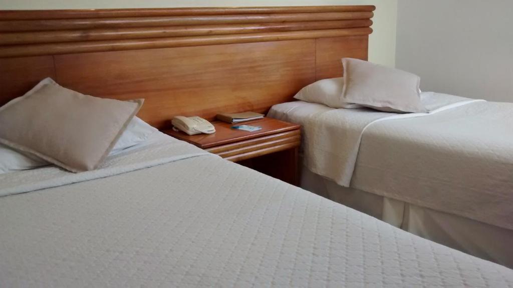 Postel nebo postele na pokoji v ubytování Gala Hotel