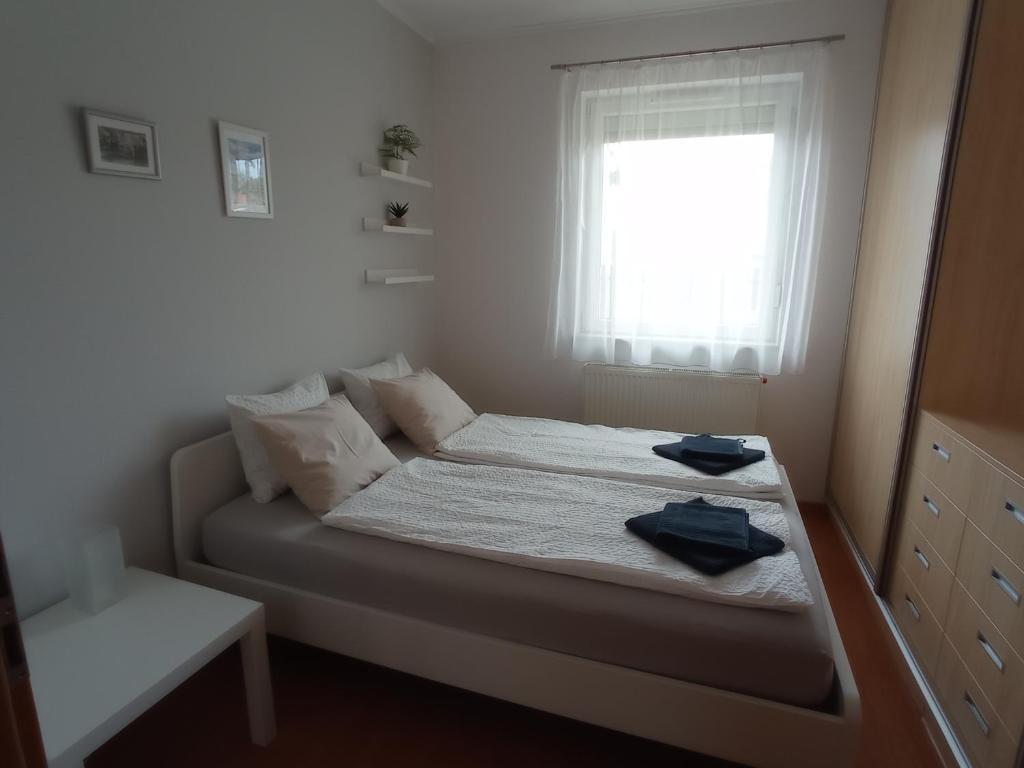 Postel nebo postele na pokoji v ubytování Budapest Airport Apartment