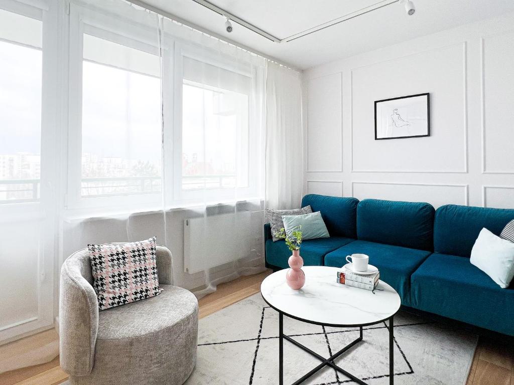 Zona d'estar a Stylowy apartament przy metrze