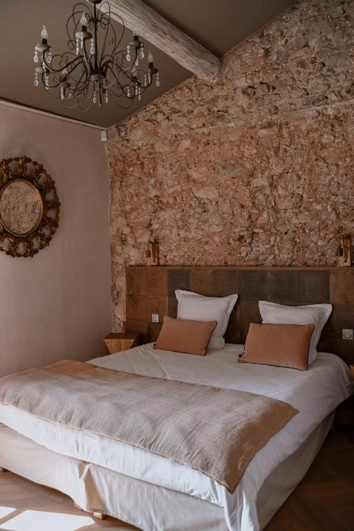 Postel nebo postele na pokoji v ubytování Bastide de l'Endre